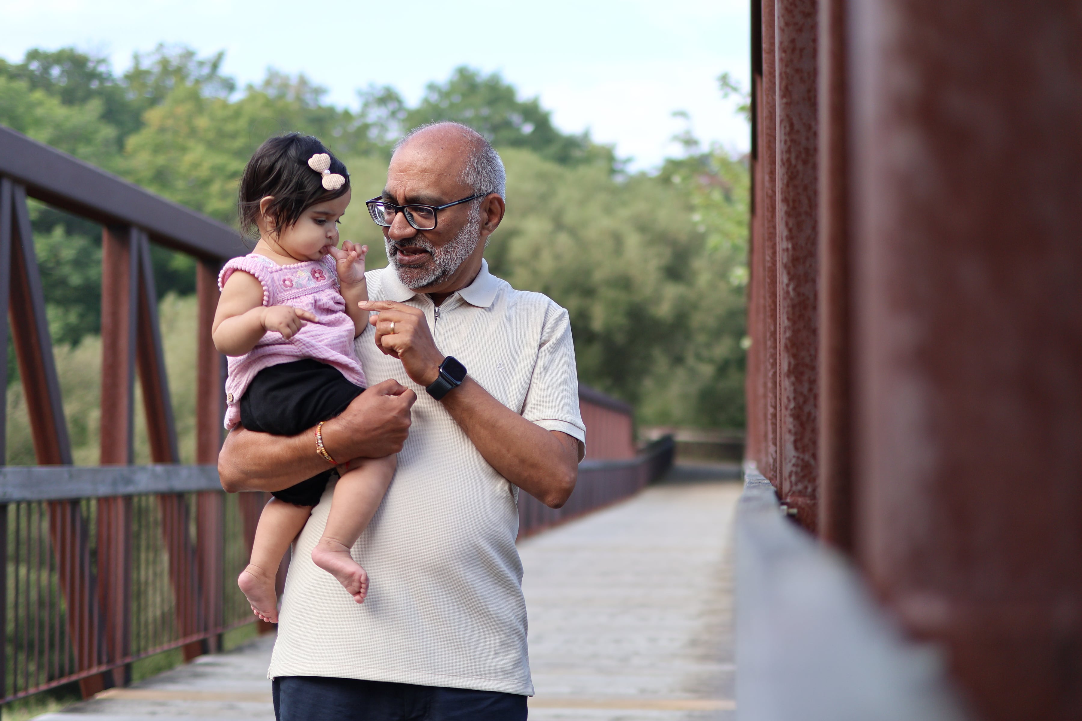 Grandfather Holding Baby